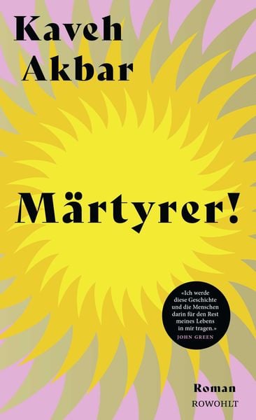 Das deutschsprachige Buchcover Märtyrer! Roman von Kaveh Akbar. Design mit einer großen, gelb-gezackten Sonne vor lilafarbenem Hintergrund und einem runden Zitat-Sticker von John Green, erschienen im Rowohlt Verlag.